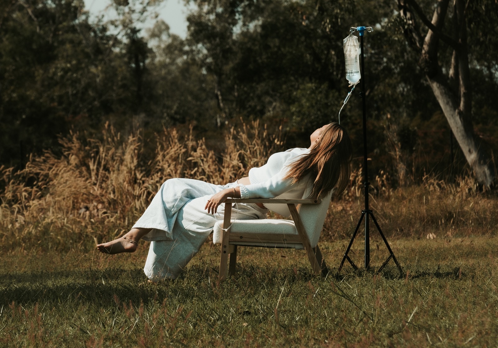 Client receiving IV drip outdoors