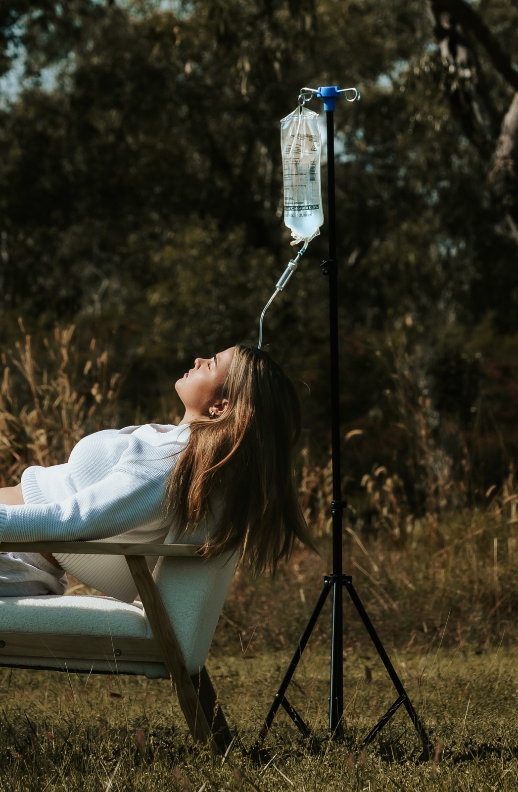 Client receiving IV drip outdoors